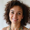 Empowered young woman, early 20s, with a healthy glow and a determined smile